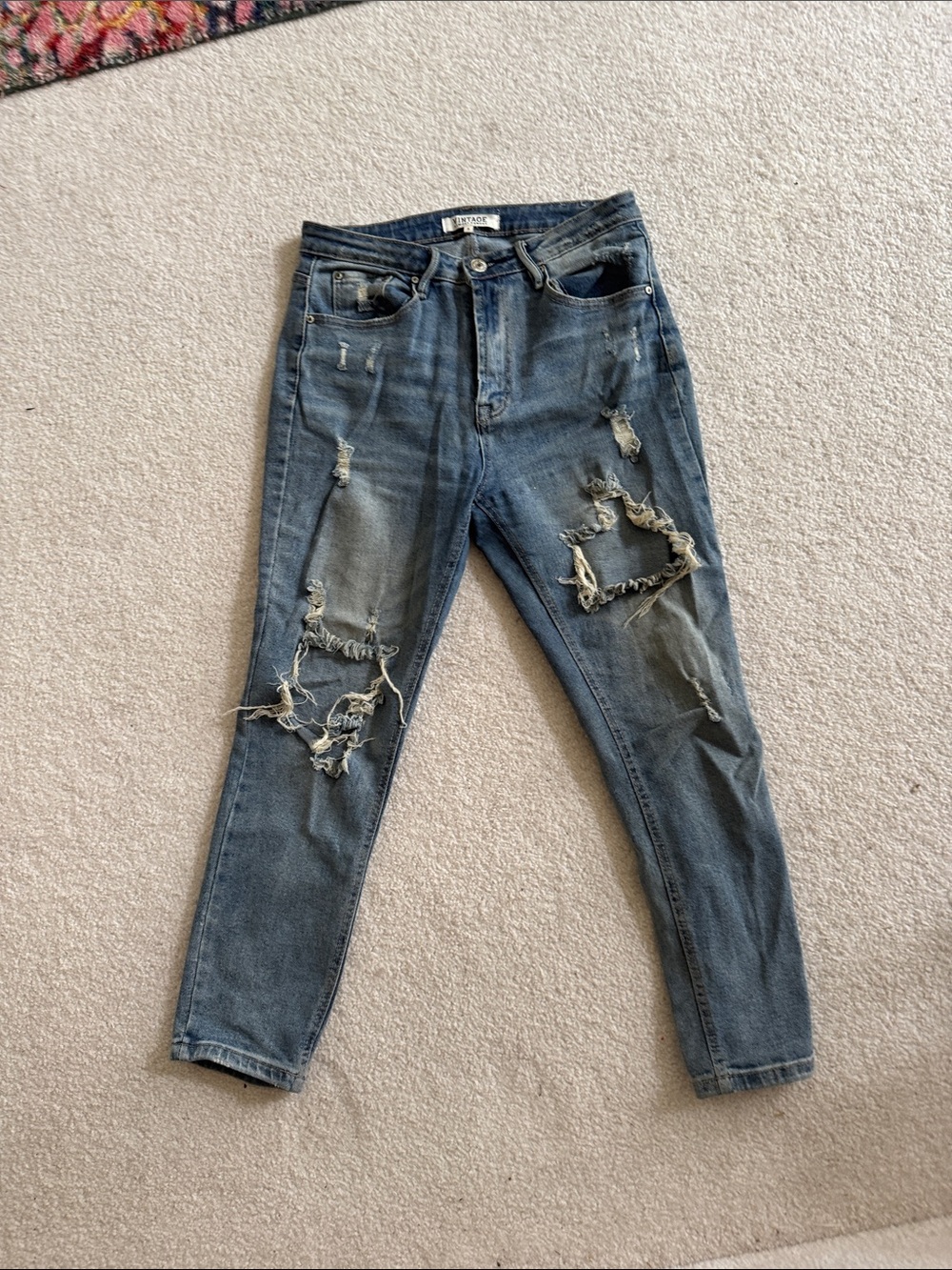 Distressed medium wash jeans